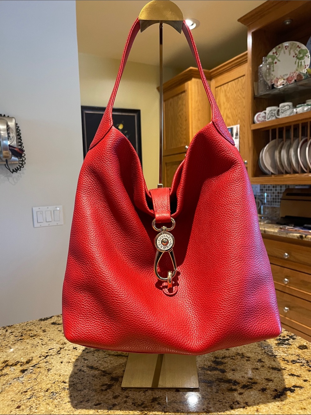 Dooney & Bourke Red Pebbled Leather Shoulder Bag with Decorative Ring Hardware